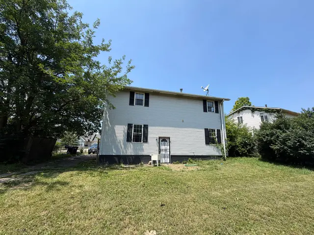 3059 E 73rd St — rear view and yard